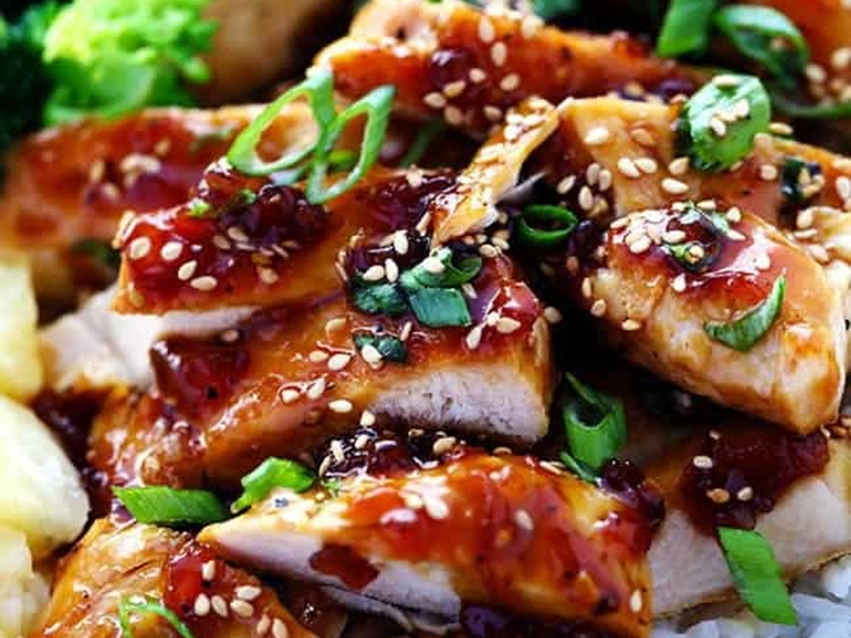 Glazed teriyaki chicken topped with sesame seeds and green onions at Oishii Express, a Japanese Restaurant in Oklahoma City