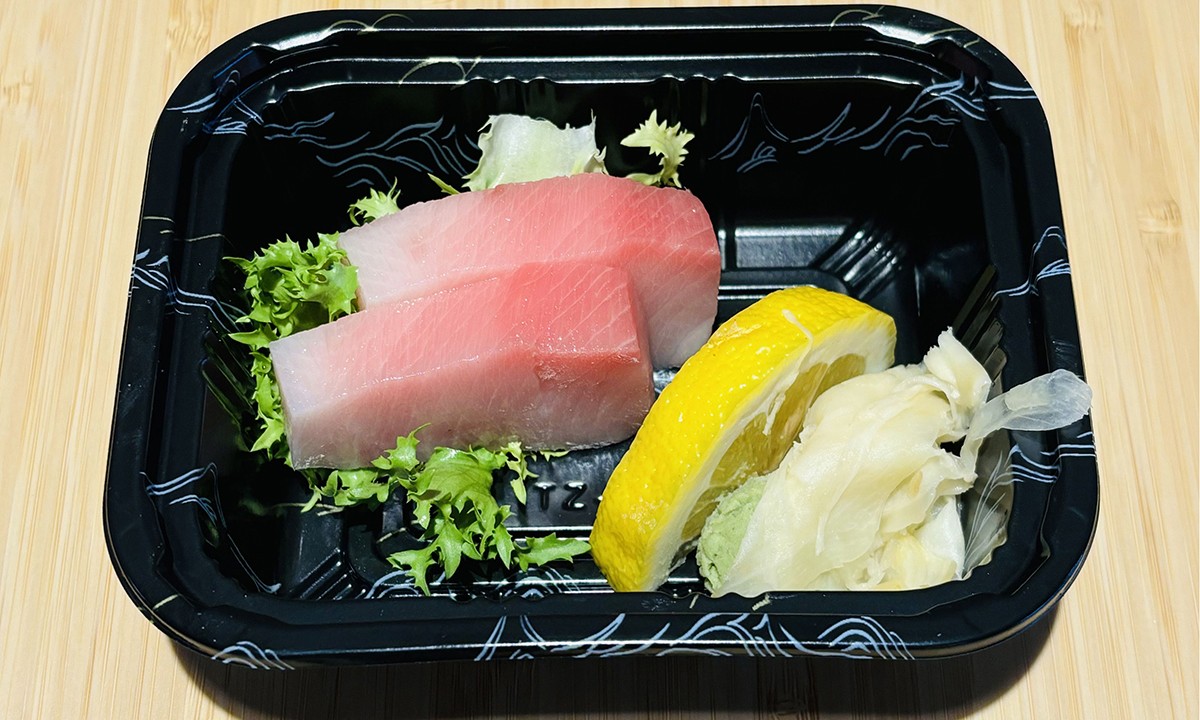 Fresh yellowtail sashimi with lemon, wasabi, and ginger at Oishi Sushi Express, a Japanese Restaurant in Cherry Hill Township