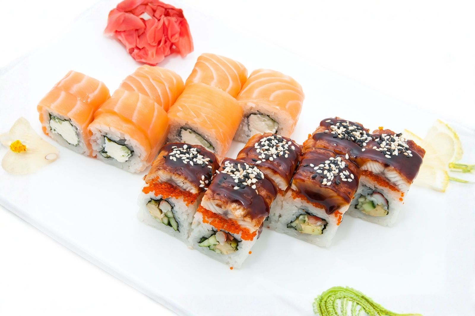 Eel and salmon maki rolls served with pickled ginger and wasabi
