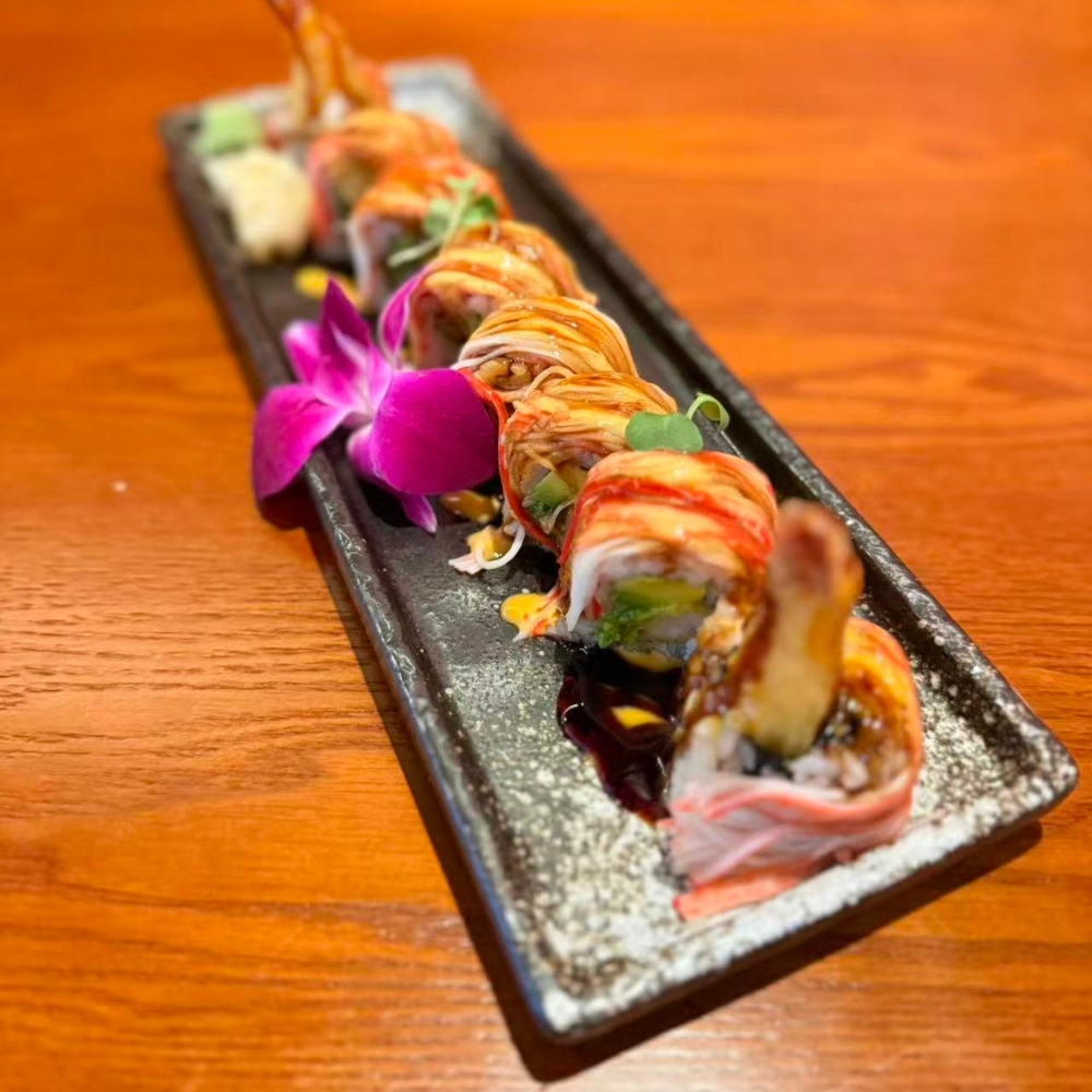 Okayama-Sushi-&-Hibachi-Japanese-Restaurant-Crazy-Monkey-Orlando Colorful sushi roll with various toppings at Okayama Sushi & Hibachi, a Japanese Restaurant in Orlando