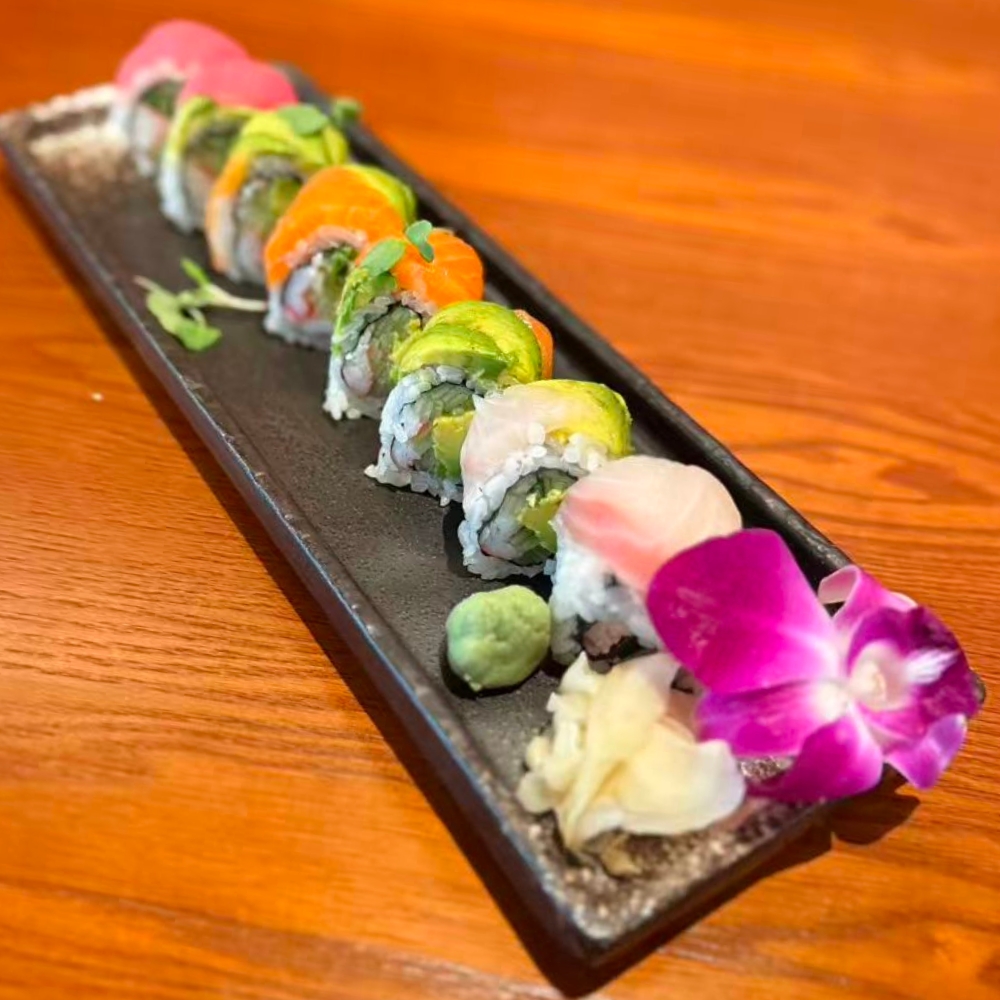 Okayama-Sushi-&-Hibachi-Japanese-Restaurant-Rainbow-Roll-Orlando Vibrant sushi roll with assorted fresh fish at Okayama Sushi & Hibachi, a Japanese Restaurant in Orlando