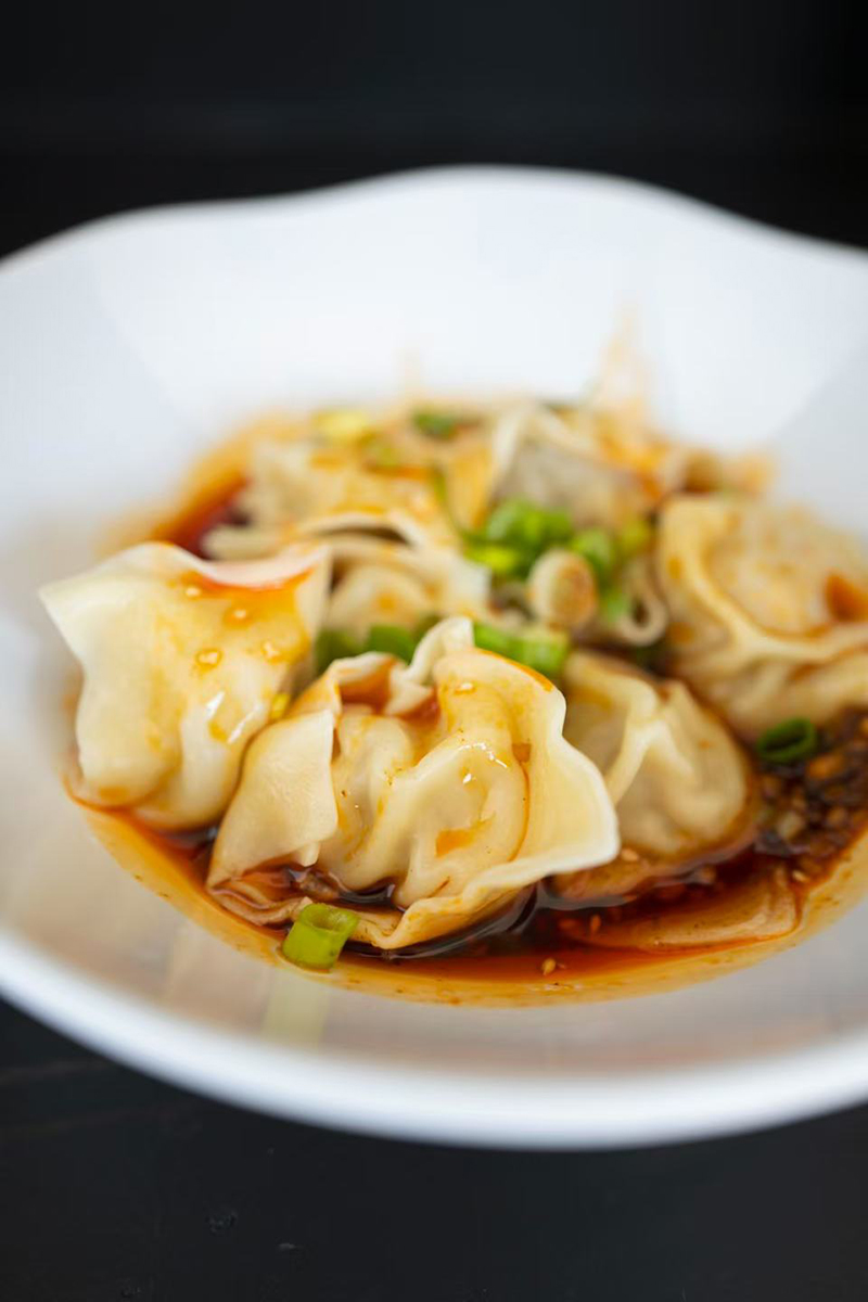 Spicy wontons in chili oil at One More Bite Dumpling House, a Chinese Restaurant in Chino