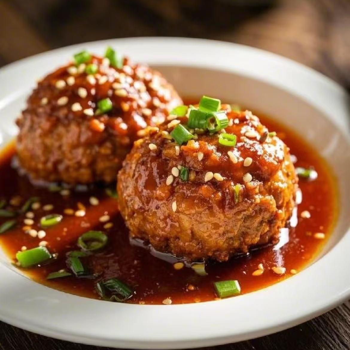 Sarge meatballs in sweet soy sauce, garnished with scallions at Opera House, a Chinese restaurant in Philadelphia