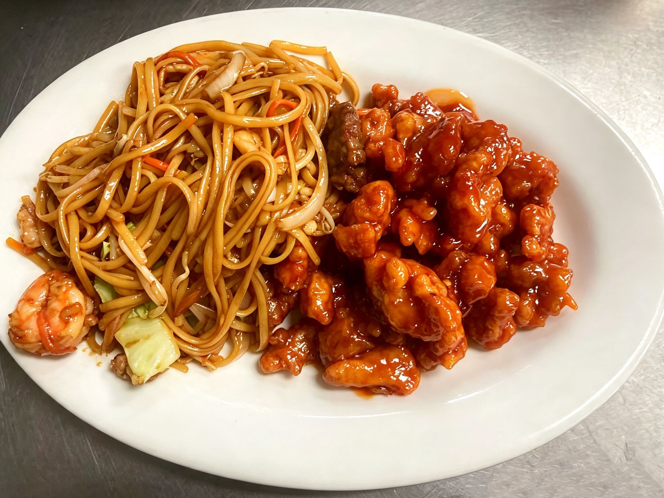 Orange chicken paired with fried noodles and shrimp at China Fortune | Chinese Food，a Chinese Restaurant in Layton