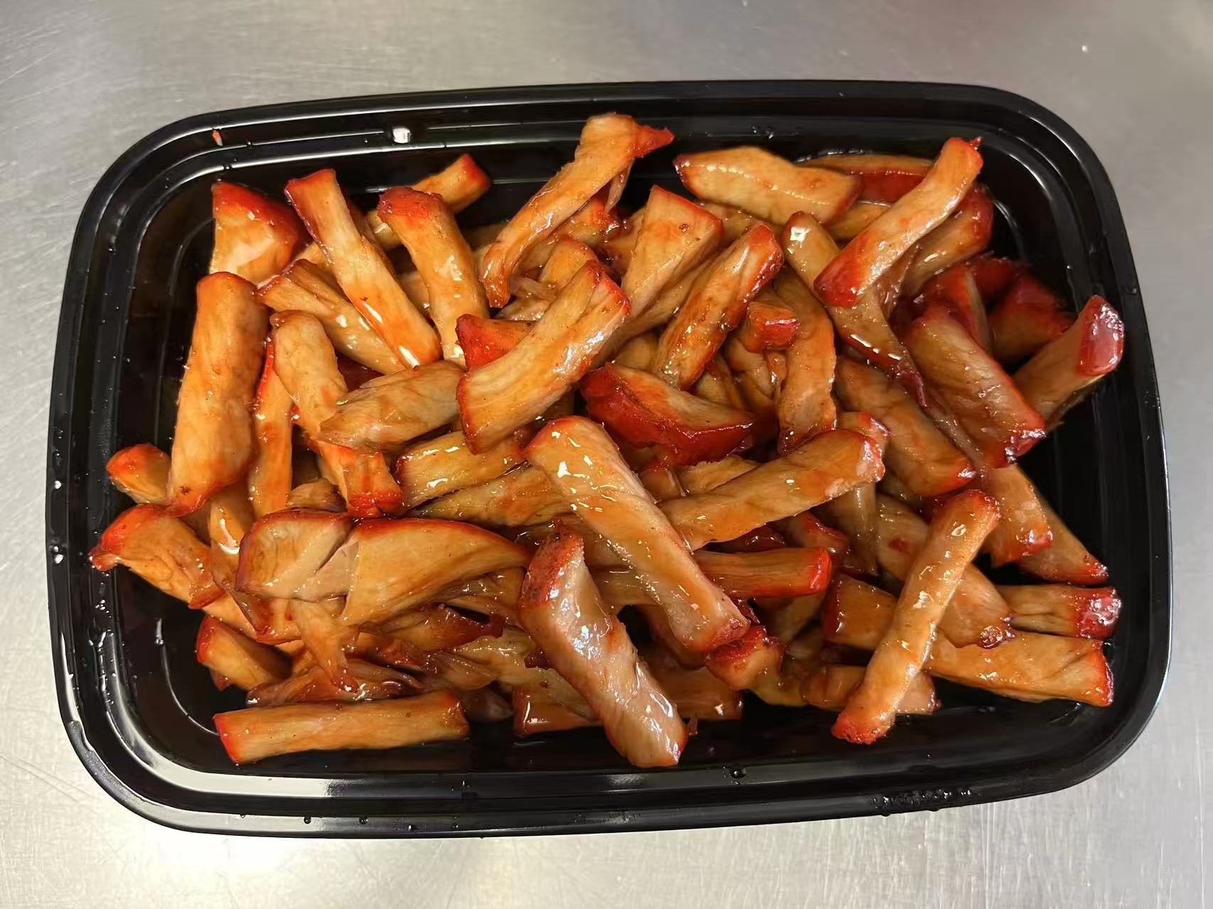 Savory, marinated pork strips glazed in BBQ sauce at Orient Chef, a Asian Restaurant in Davie