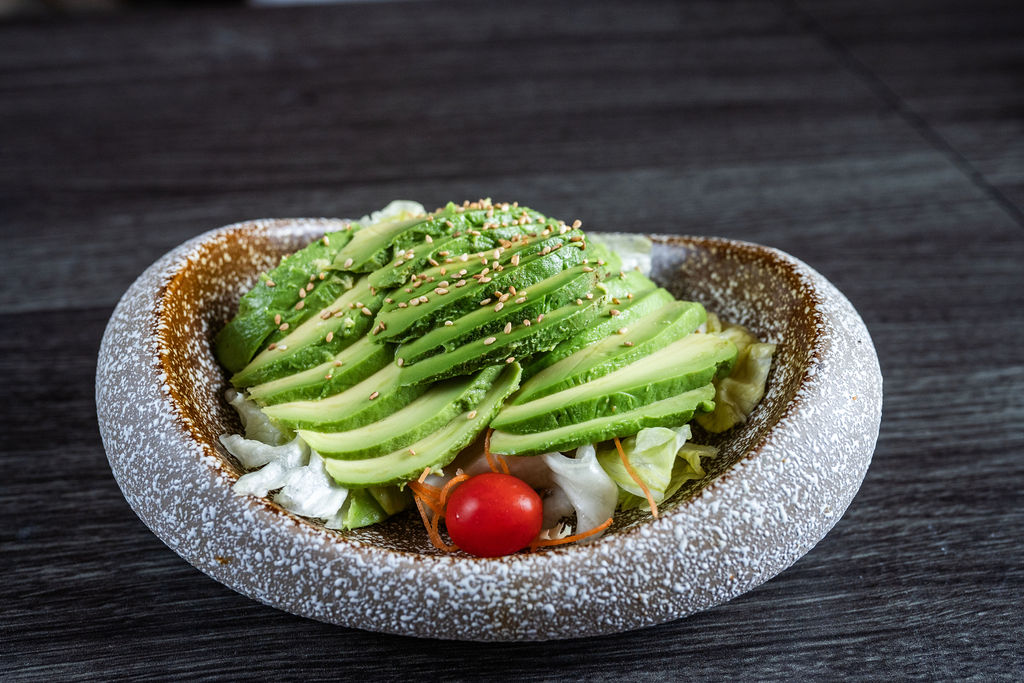 Fresh avocado salad with lettuce, tomato and sesame seeds at Origami Asian Fusion Exton, an Asian Fusion Restaurant in Exton