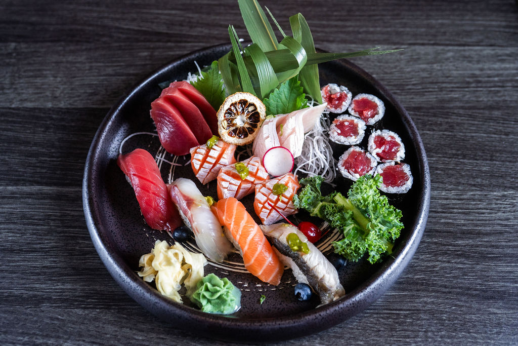 Assorted sushi and sashimi platter with tuna, salmon and garnishes at Origami Asian Fusion Exton, an Asian Fusion Restaurant in Exton
