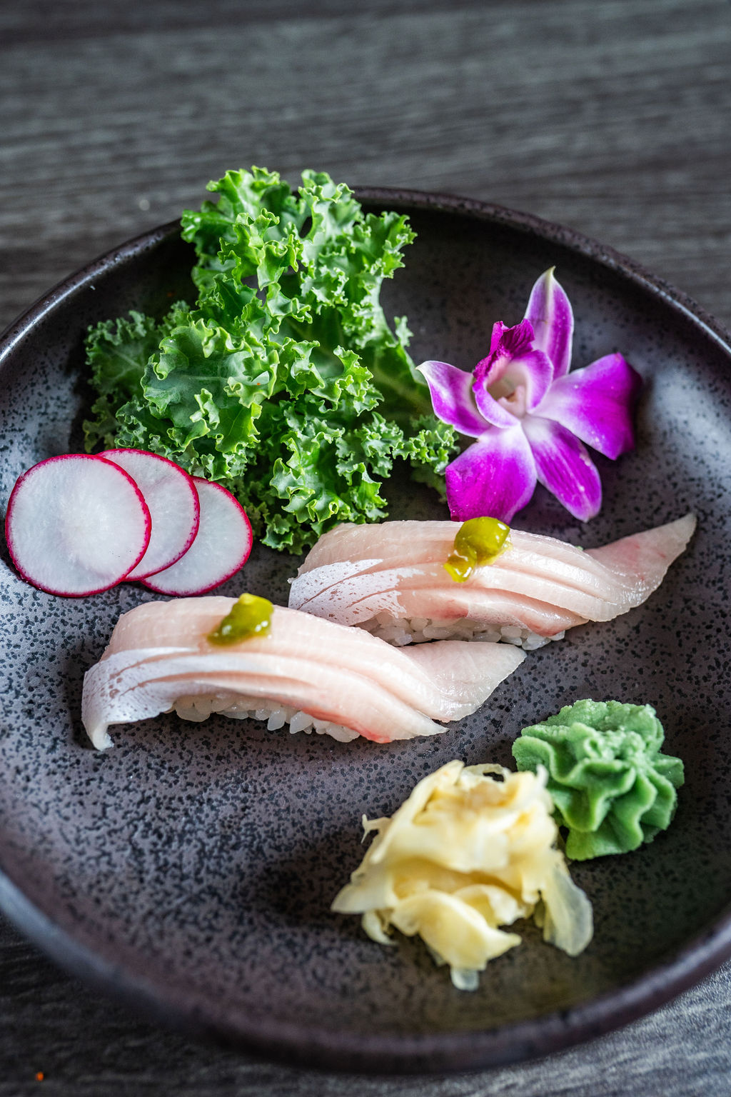 Yellowtail belly nigiri sushi with garnishes at Origami Asian Fusion Exton, an Asian Fusion Restaurant in Exton