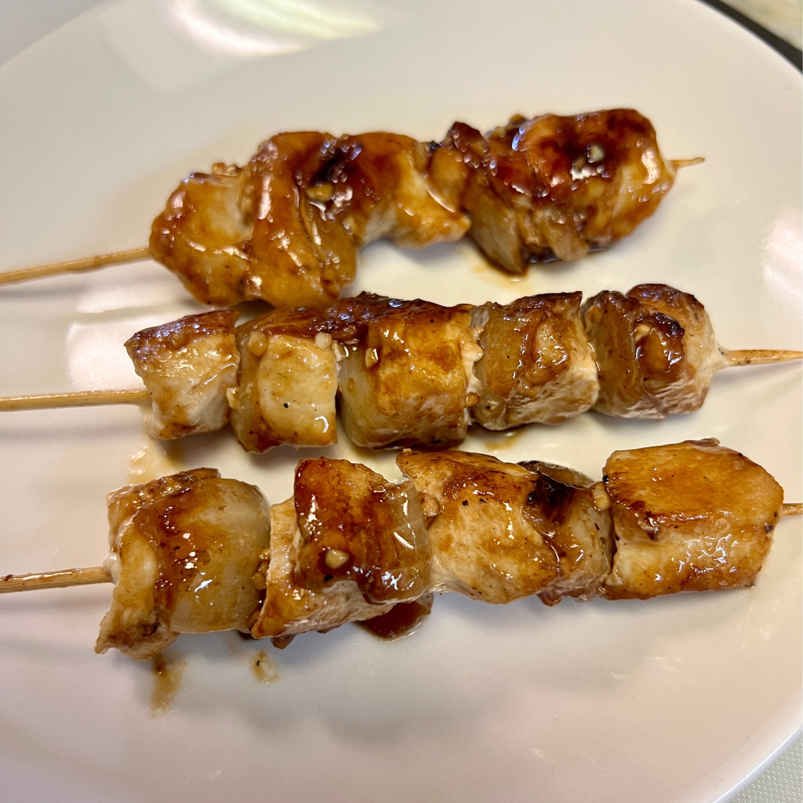 Grilled chicken skewers with savory sauce at OSAKA Japanese Cuisine, a Japanese Restaurant in Buffalo