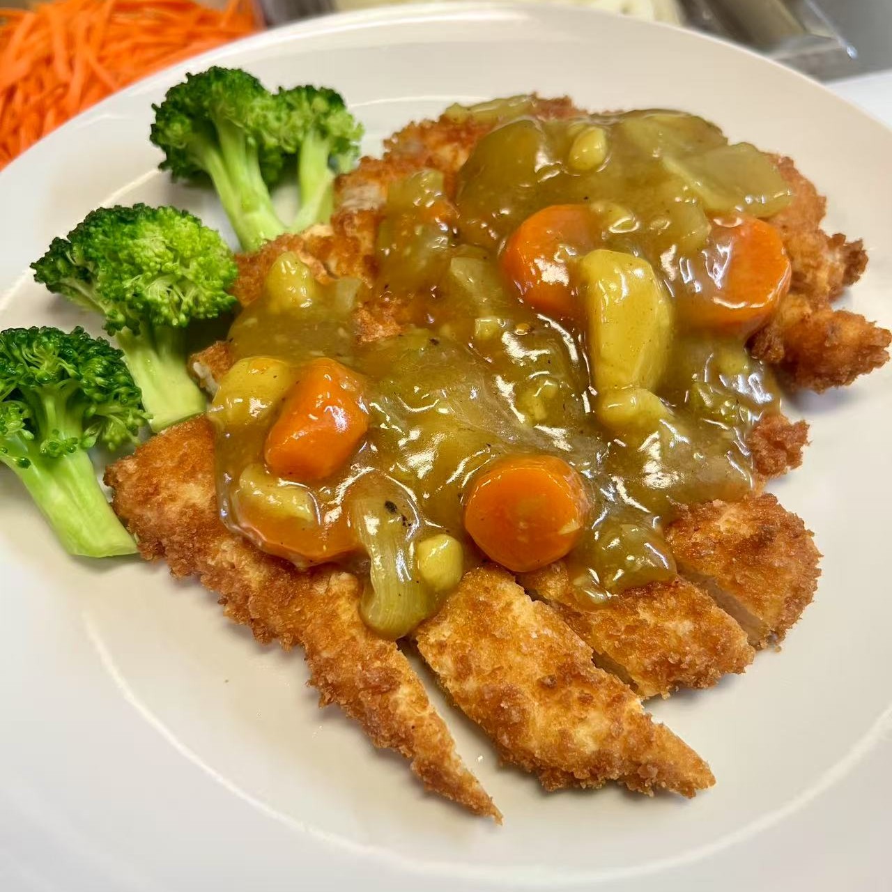 Crispy chicken cutlet with Japanese curry sauce and vegetables at OSAKA Japanese Cuisine, a Japanese Restaurant in Buffalo