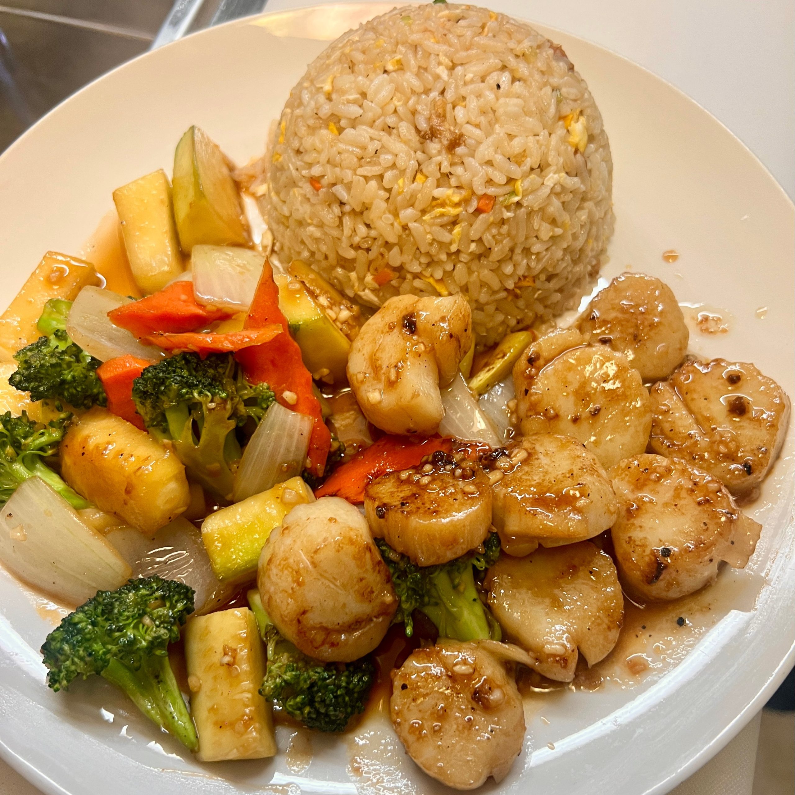 Pan - seared scallops served with fried rice and mixed vegetables at OSAKA Japanese Cuisine, a Japanese Restaurant in Buffalo