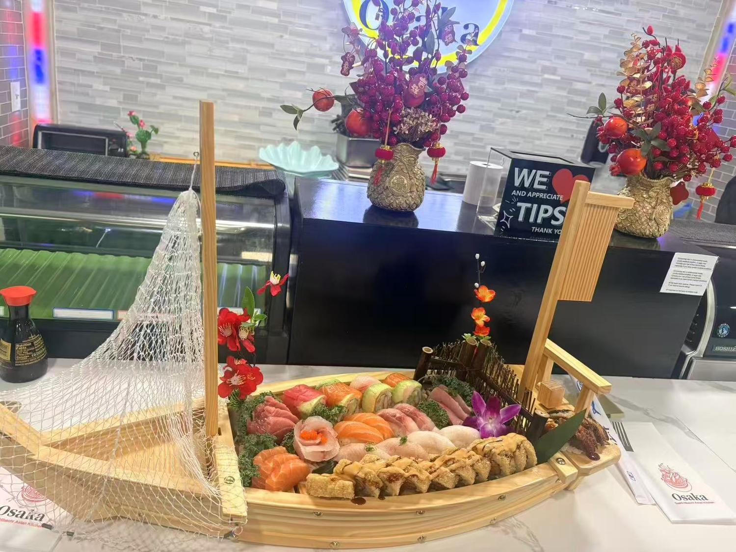 Osaka restaurant sushi bar with counter, stools, and Osaka logo