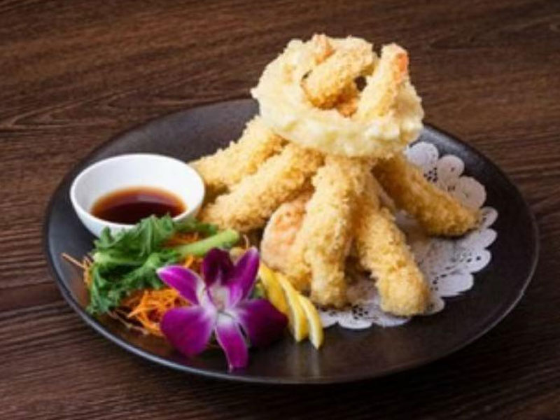 Crispy shrimp tempura with soy sauce, lemon, orchid at Osaka Sushi Hibachi Asian Kitchen, a Asian Restaurant in Lake City