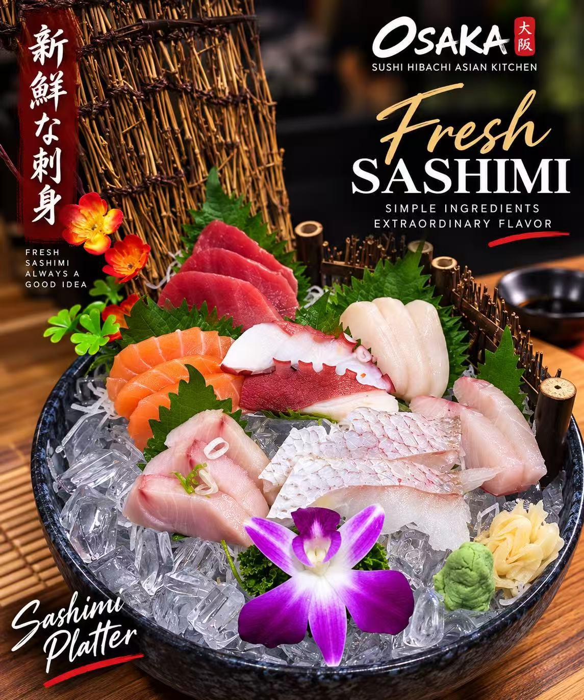Fresh assorted sashimi platter on ice with colorful edible flowers at Osaka Sushi Hibachi