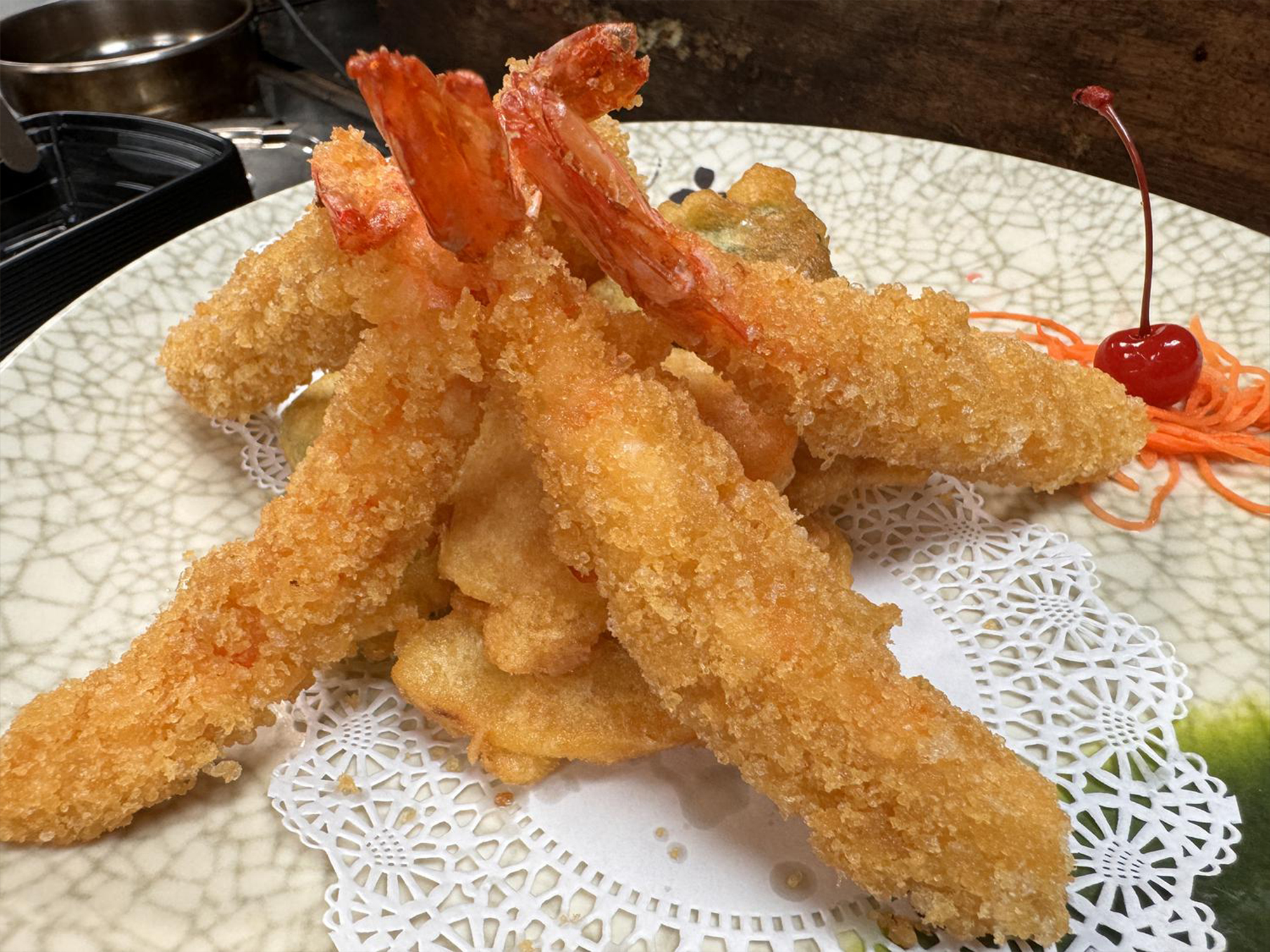 Crispy fried shrimp tempura with garnishes at Osaka Sushi Bar, a Japanese Restaurant in Montgomery