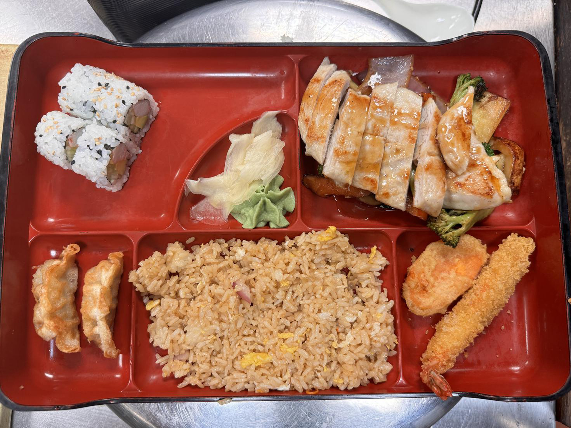 Chicken hibachi bento box with rice and sushi at Osaka Sushi Bar, a Japanese Restaurant in Montgomery