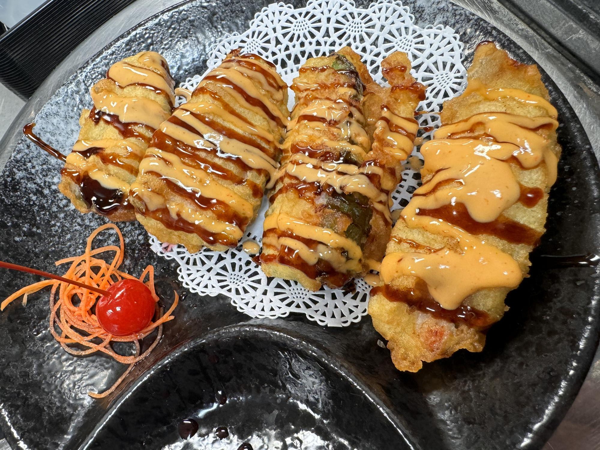 Tempura rolls with spicy mayo and teriyaki sauce at Osaka Sushi Bar, a Japanese Restaurant in Montgomery
