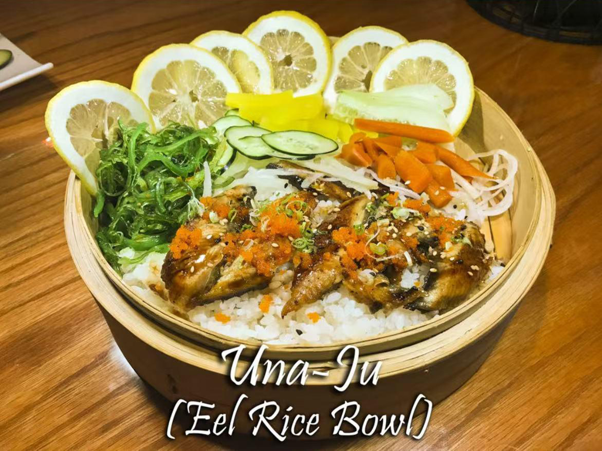 Unaju grilled eel rice bowl with garnishes at Osaka Sushi Bar, a Japanese Restaurant in Montgomery