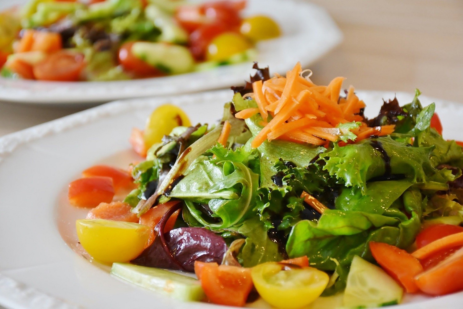 Fresh vegetable salad with mixed greens and cherry tomatoes at Osake，a Japanese Restaurant in Covington