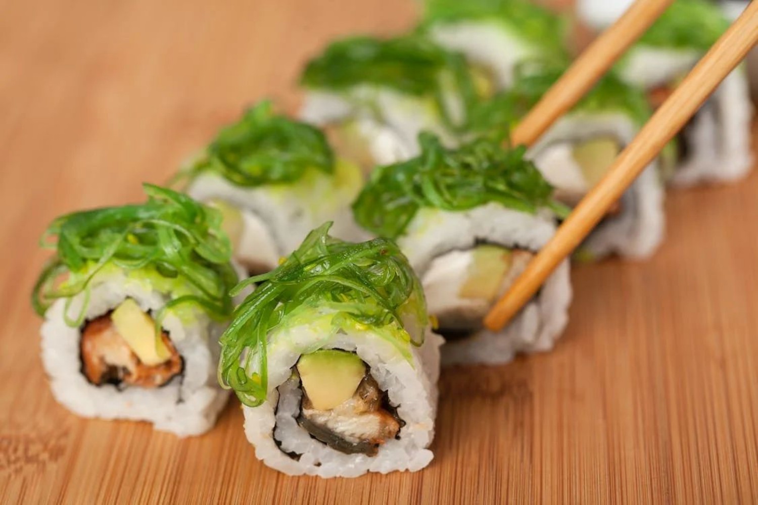 Sushi rolls topped with fresh green seaweed at Osake，a Japanese Restaurant in Covington