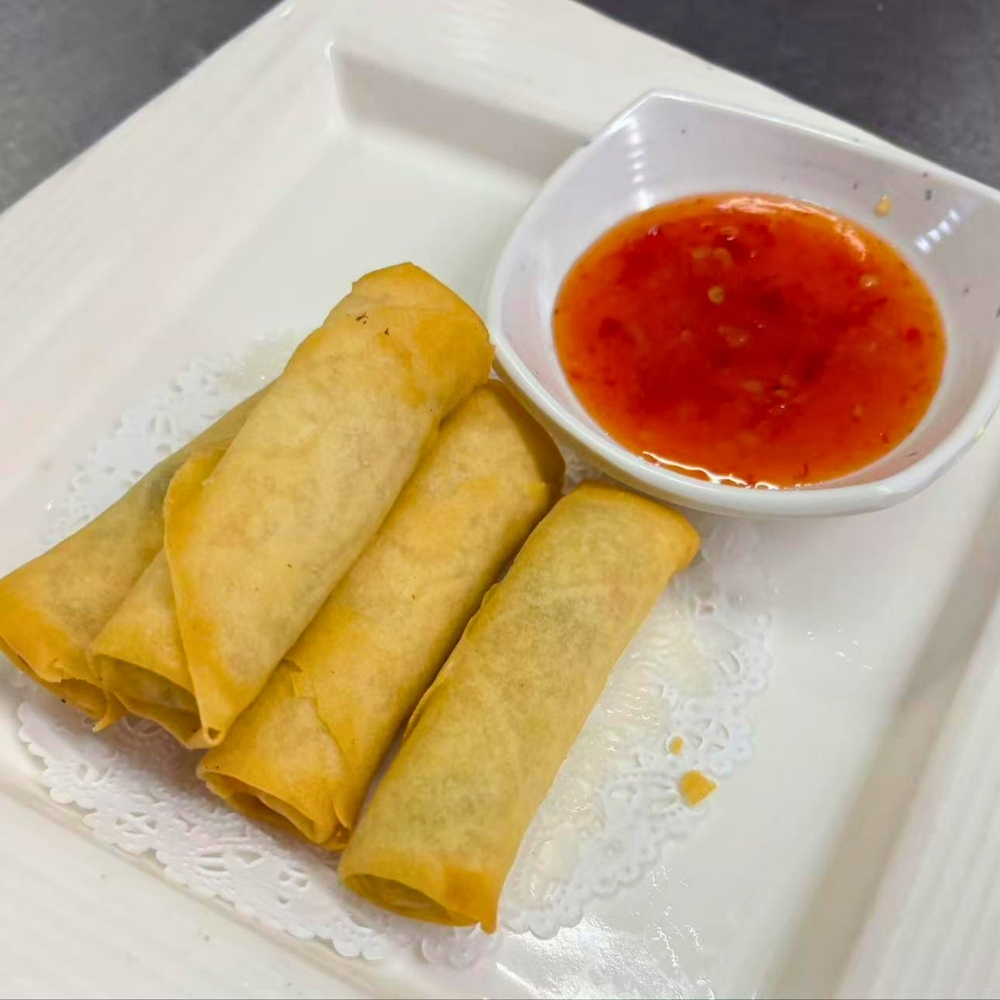 Crispy fried spring rolls with sweet chili sauce at Osaki Japanese Restaurant, a Japanese Restaurant in Hays