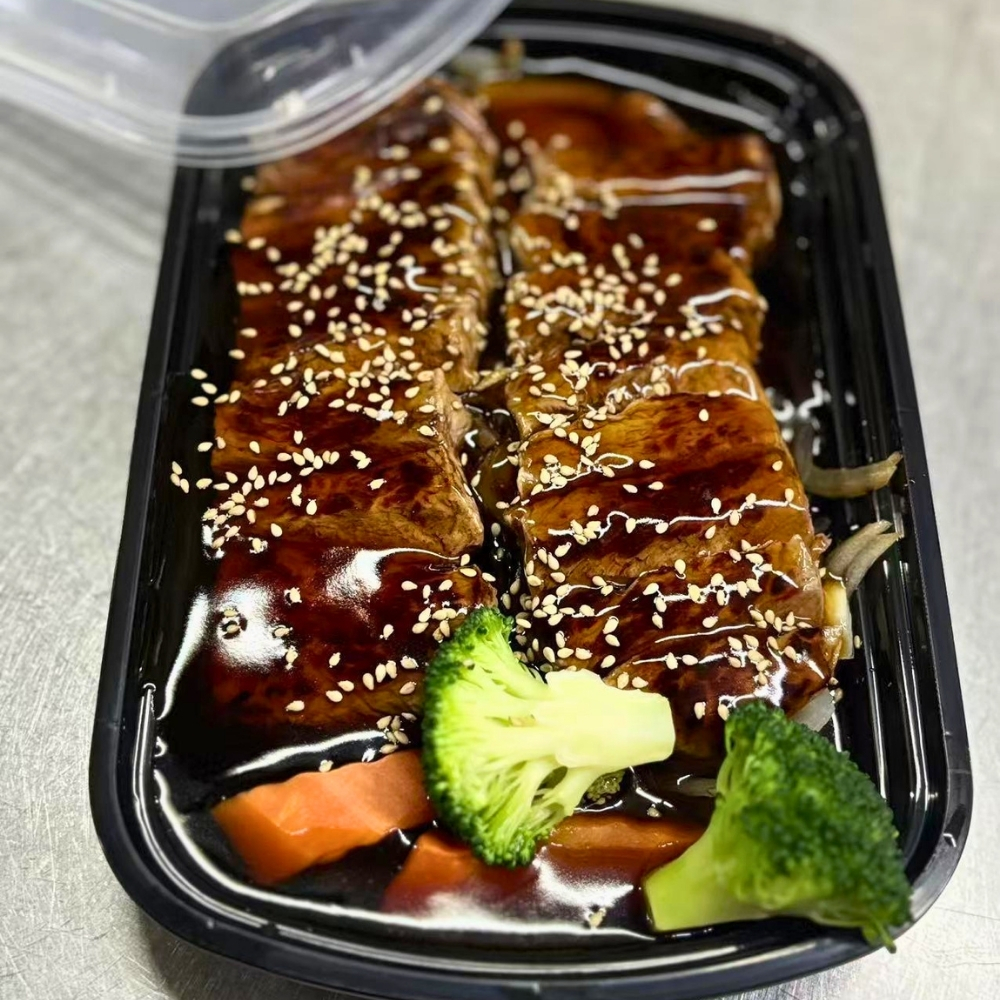 Teriyaki beef topped with sesame seeds and veggies at Osaki Japanese Restaurant, a Japanese Restaurant in Hays