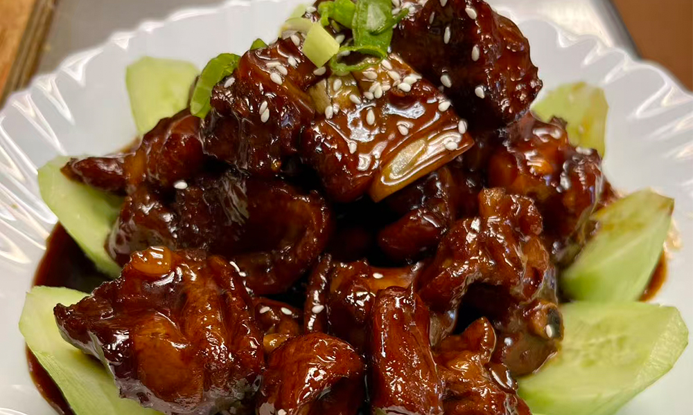 Tender spare ribs in sweet and sour sauce, glazed and flavorful at Pacific Eatery Restaurant in Kenny Rd, Columbus