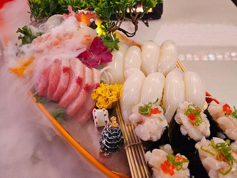 Signature nigiri with yellowtail, squid, and scallops at Pakusan Sushi & Grill, a Japanese Restaurant in Chandler