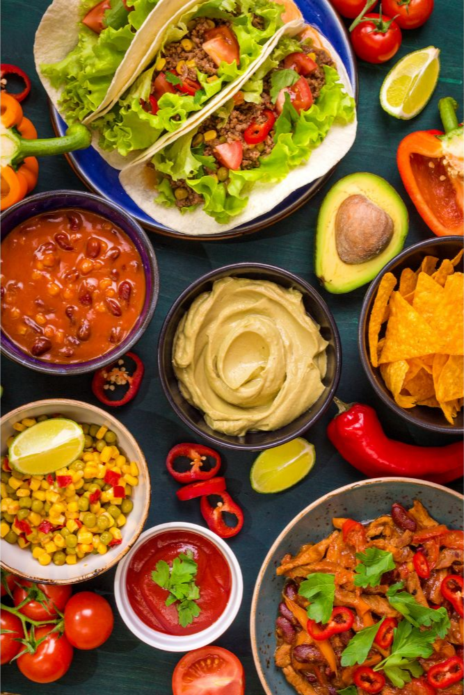 Assorted Mexican meal spread with tacos and sides at Panadería Corona, a Mexican Style Restaurant in Houston