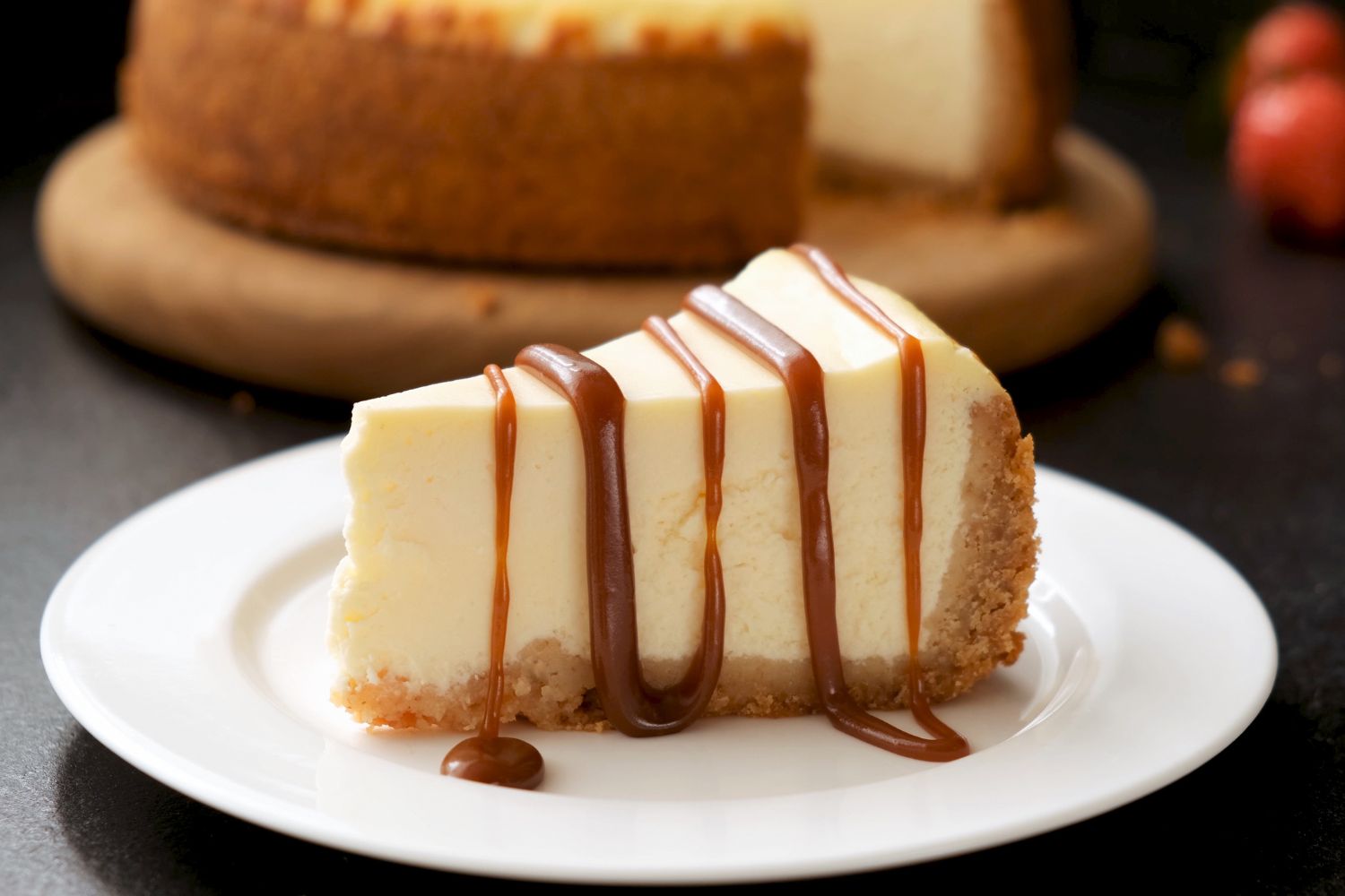 Classic caramel drizzle cheesecake slice at Panadería Corona, a Mexican Style Restaurant in Houston