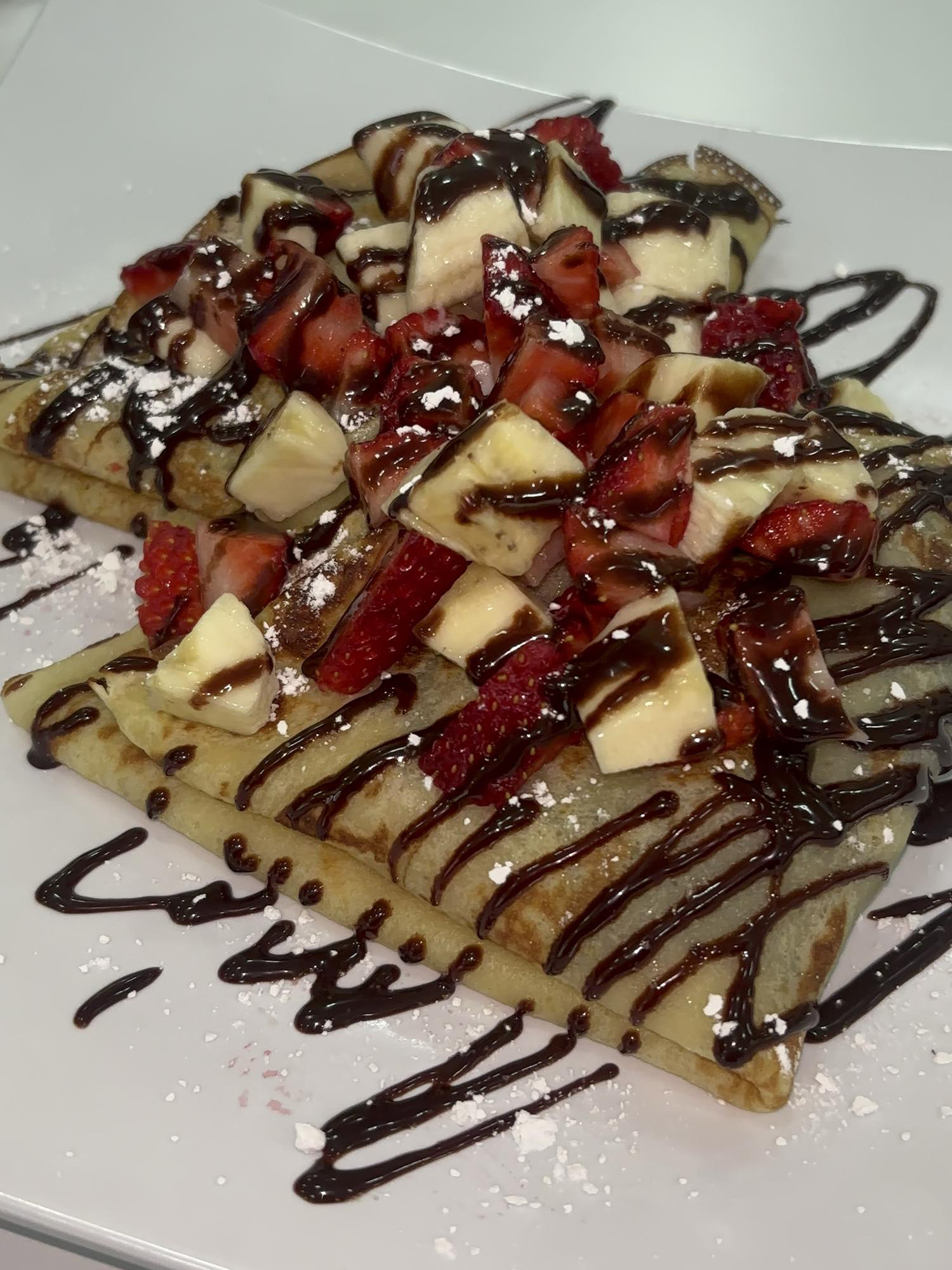 Crepes with Strawberries, Bananas, and Chocolate Sauce at Panadería Corona, a Mexican Style Restaurant in Houston