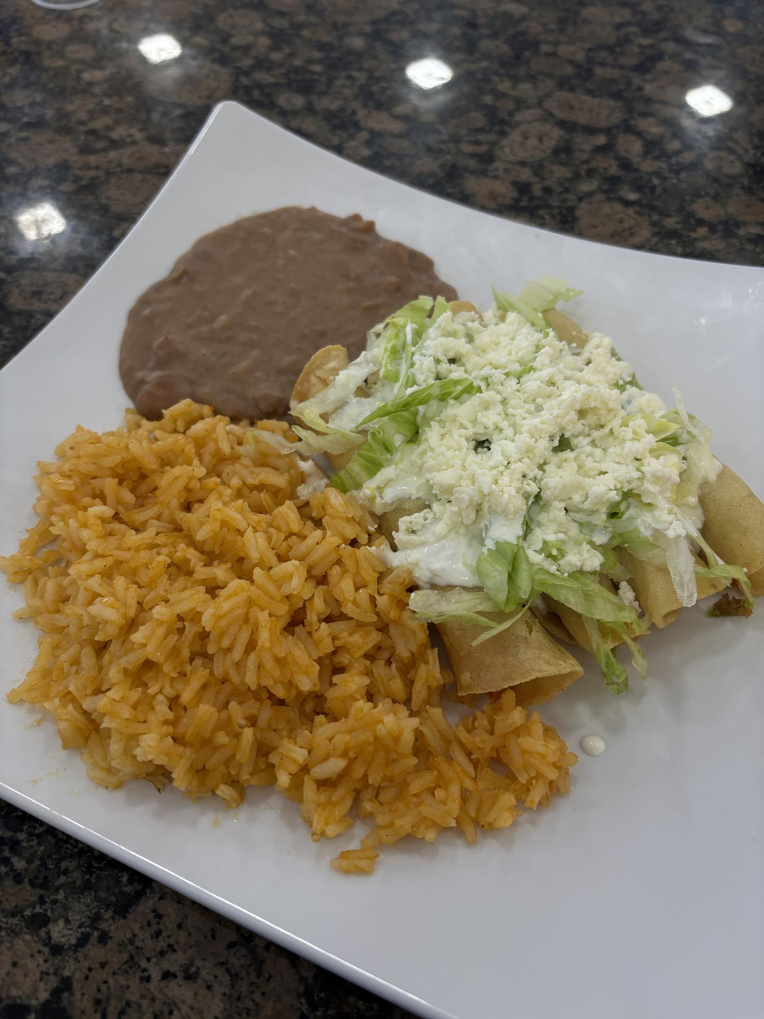 Flautas with Mexican Rice and Refried Beans at Panadería Corona, a Mexican Style Restaurant in Houston