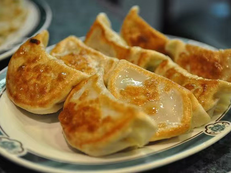 Golden crispy pan-fried dumplings at Panda Buffet, a Buffet Restaurant in Cushing