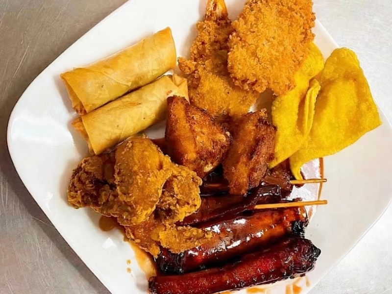 Assorted fried appetizer platter with egg rolls, wings, and ribs at Panda Hibachi, a Chinese Restaurant in Duncan