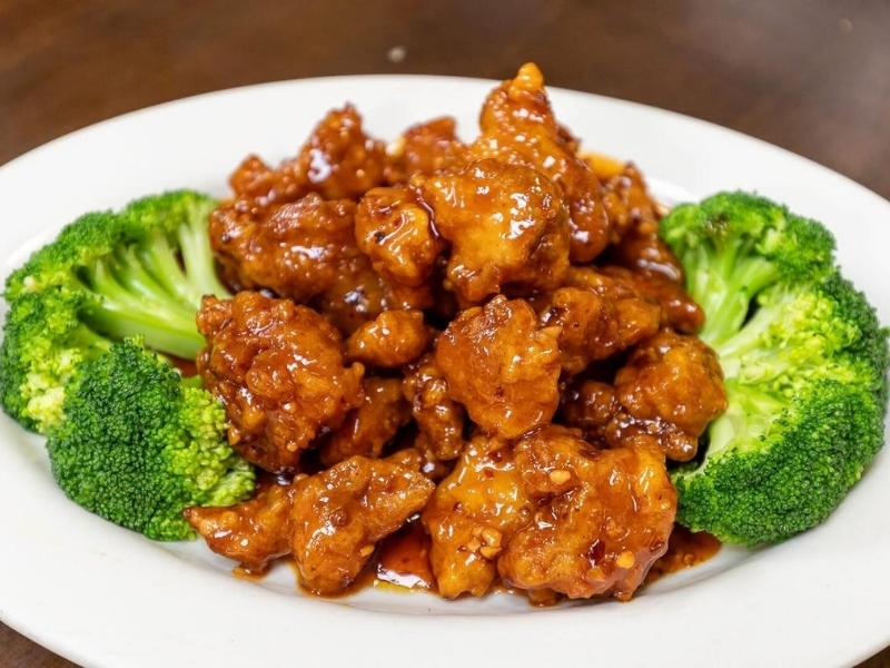 Sweet and tangy orange chicken with orange slices at Panda Hibachi, a Chinese Restaurant in Duncan