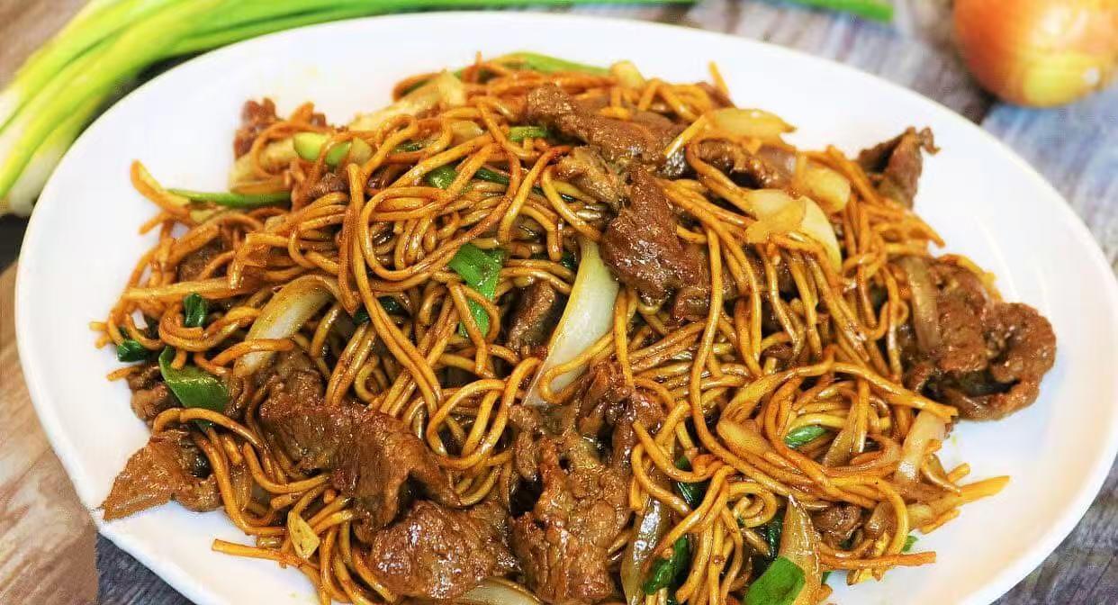 Savory beef lo mein with onions and scallions at Panda Hibachi, a Chinese Restaurant in Duncan