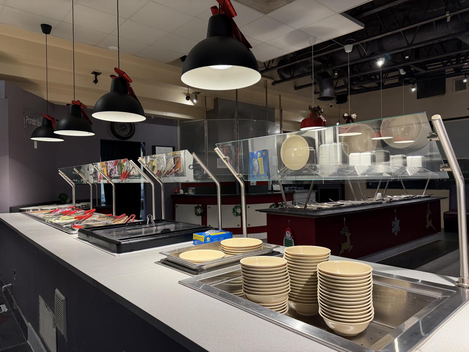 Food bar setup with plates & serving stations at Panda Mongolian BBQ, a Chinese Restaurant in Orange