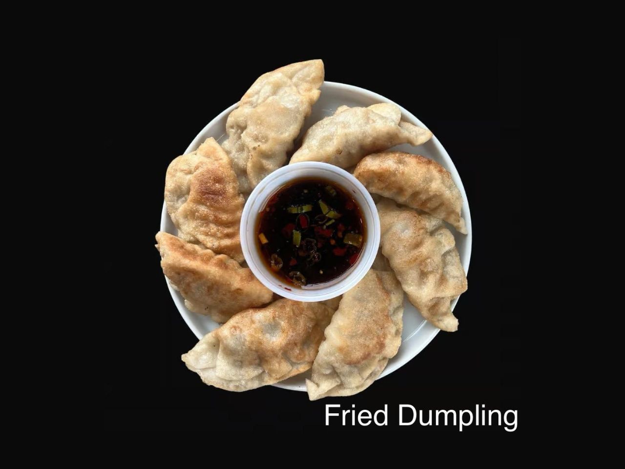 Fried dumplings with dipping sauce at Pan Pann, a Chinese Restaurant in Livonia