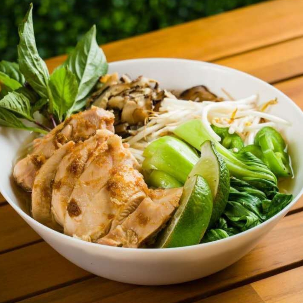 Chicken noodle soup with meat, noodles, and greens at PHO 1, a Vietnamese Restaurant in Flanders.