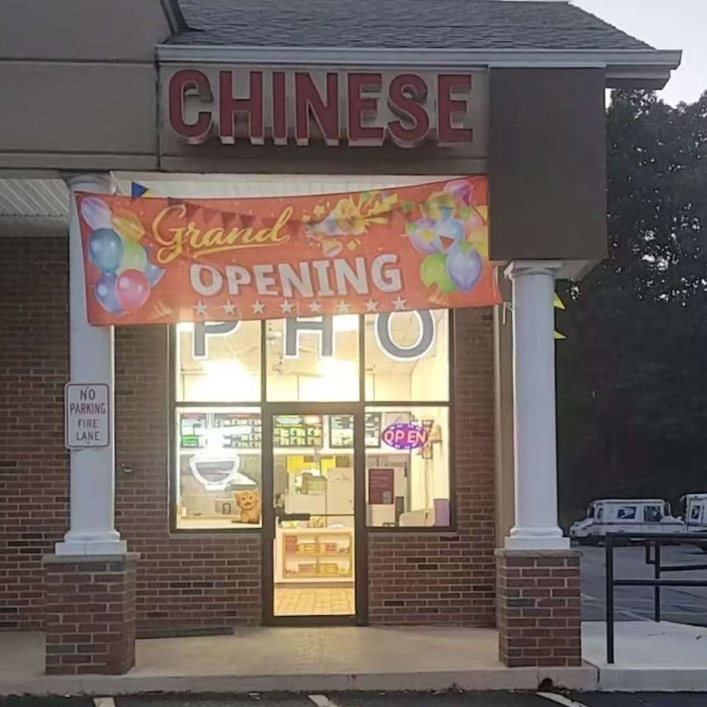 Exterior of PHO 1 with "Grand Opening" banner at PHO 1, a Vietnamese Restaurant in Flanders.