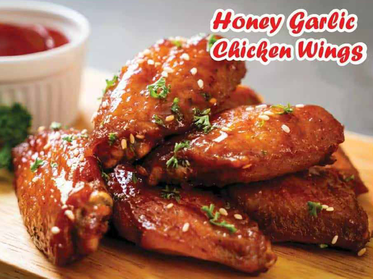Pho-House-Asian-Fusion-Restaurant-Honey-Garlic-Chicken-Wings-Carmichael A plate of sticky and sweet honey garlic chicken wings at Pho House, a Asian Fusion Restaurant in Carmichael