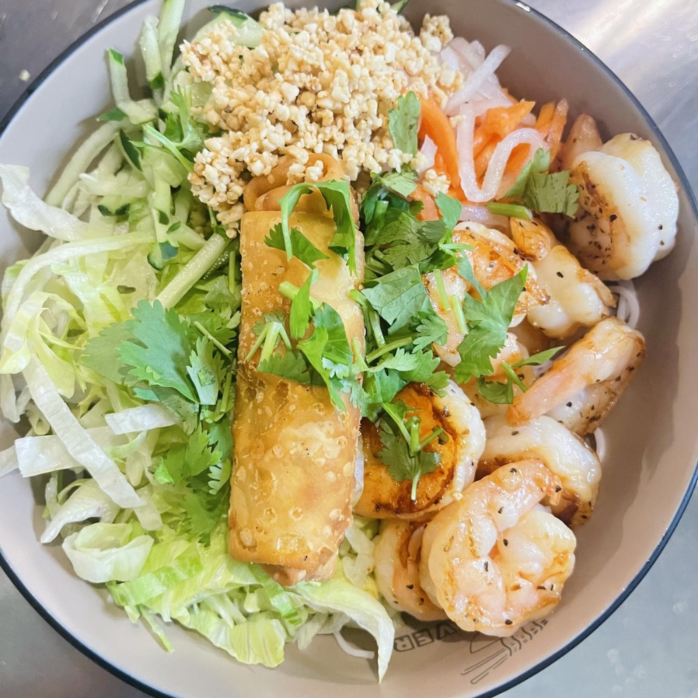 Bowl with shrimp, spring roll, fresh veggies, and herbs at Pho Lover, a Vietnamese Restaurant in Galesburg