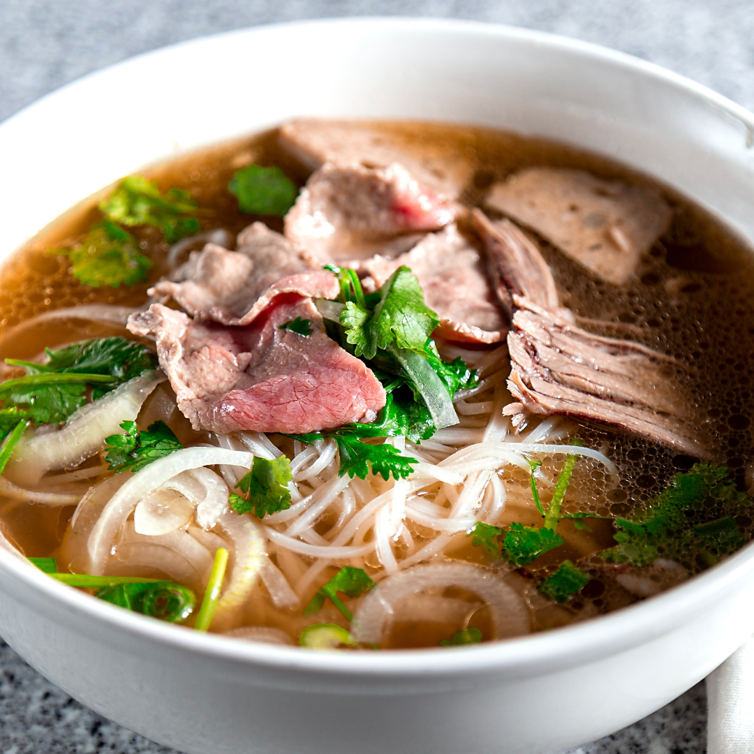 Pho-Plus-1-Vietnamese-restaurant-Coriander-Beef-Pho-Oklahoma-City Coriander Beef Pho - Beef slices, rice noodles, garnished with coriander in broth at Pho Plus 1, a Vietnamese restaurant in Oklahoma City