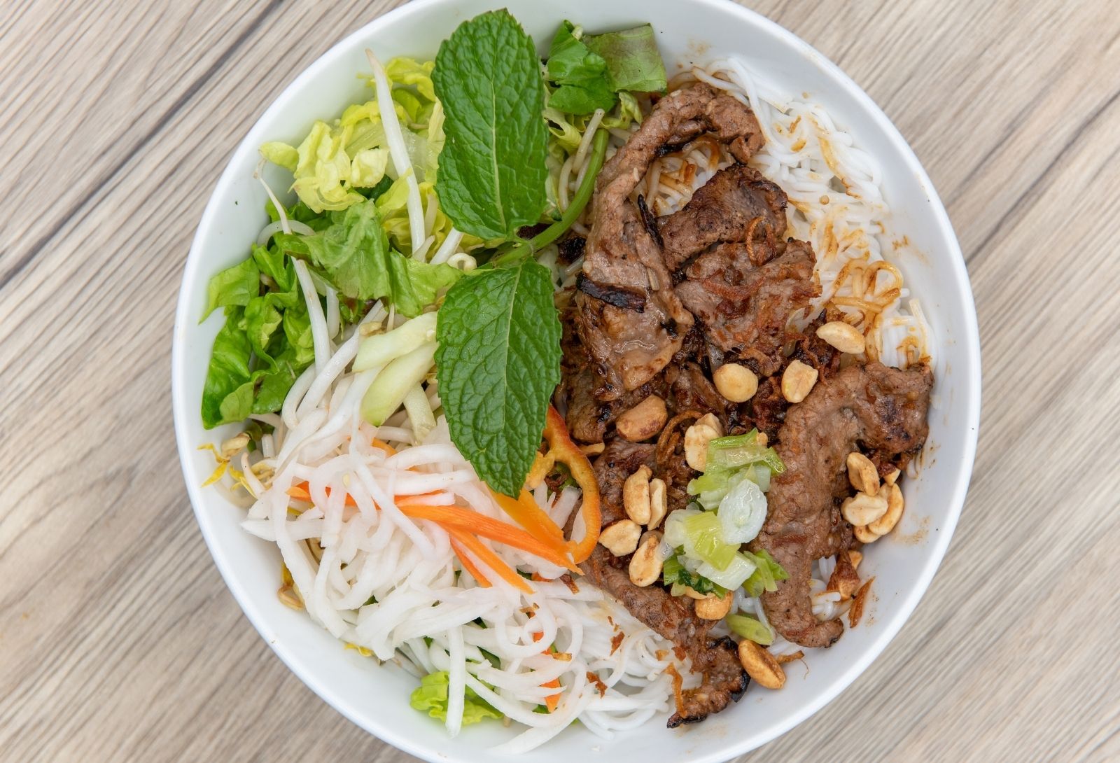 Grilled beef vermicelli salad with fresh mint, veggies and peanuts at Pho Saigon, a Vietnamese Restaurant in Grand Island
