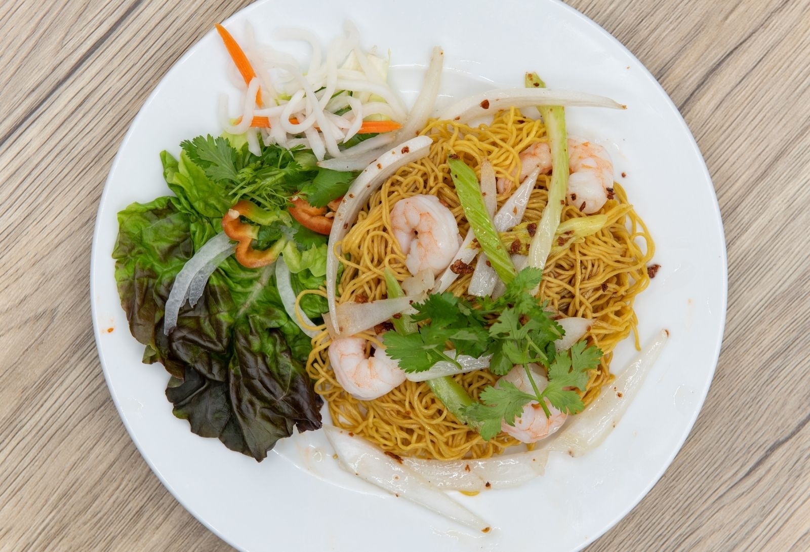 Shrimp egg noodles served with fresh greens and pickled veggies at Pho Saigon, a Vietnamese Restaurant in Grand Island