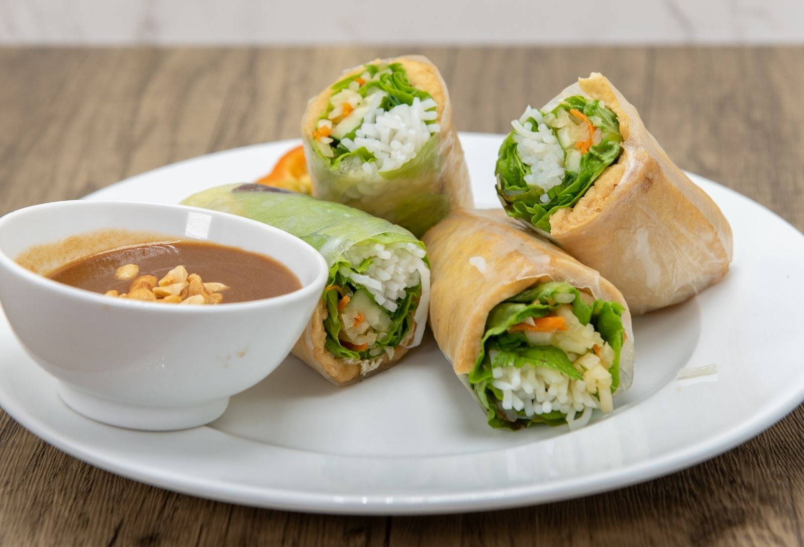 Fresh Vietnamese spring rolls with creamy peanut dipping sauce at Pho Saigon, a Vietnamese Restaurant in Grand Island