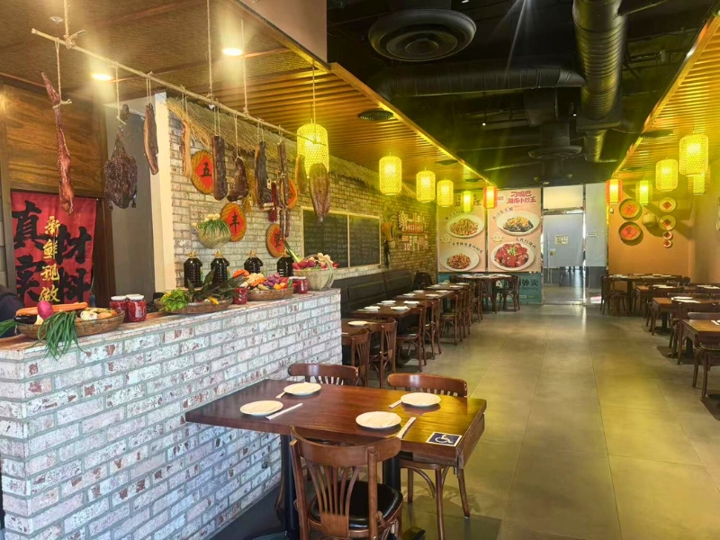 Dining area with cured meat and fresh produce displays at Picky Hunan, a Hunan Restaurant in Alhambra