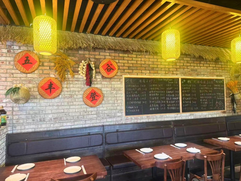 Dining booths and menu blackboard with Hunan decor at Picky Hunan, a Hunan Restaurant in Alhambra