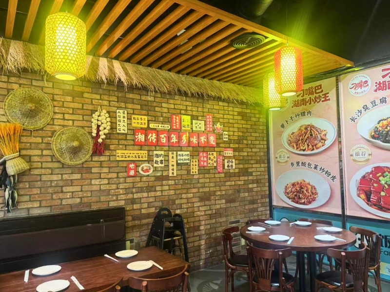 Rustic brick wall with Hunan-style decor and bamboo lanterns at Picky Hunan, a Hunan Restaurant in Alhambra