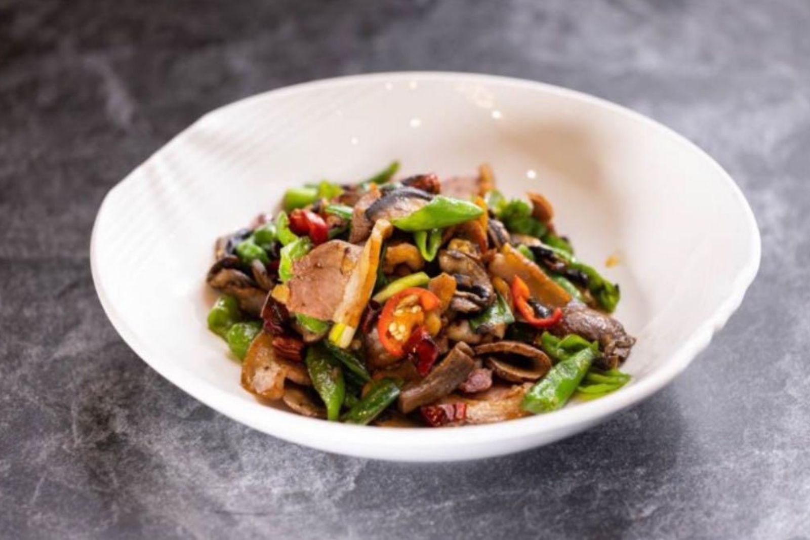 Stir-fried mushroom with green peppers & Yunnan-style ham at Ping's Bistro Rowland, a Chinese Restaurant in Hacienda Heights